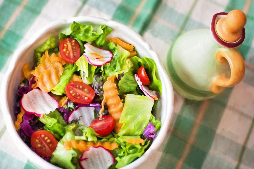 a salad with tomatoes and other vegetables