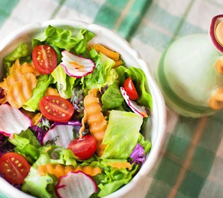 a salad with tomatoes and other vegetables