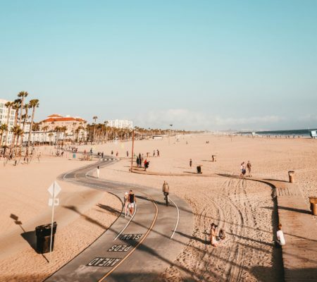 a beach with people and buildings