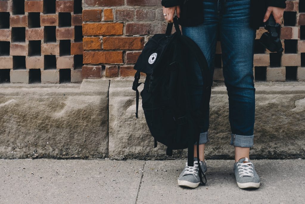 a man and woman walking down a sidewalk