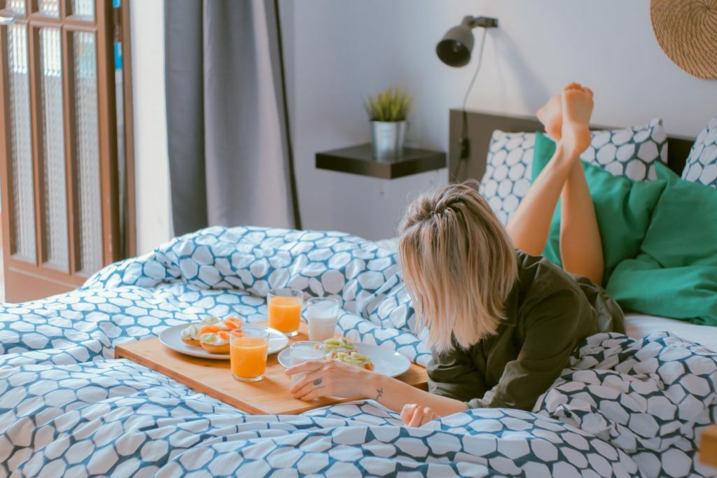 a person lying on a bed