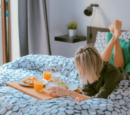 a person lying on a bed