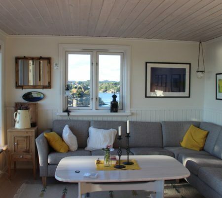 a living room with a couch and a table