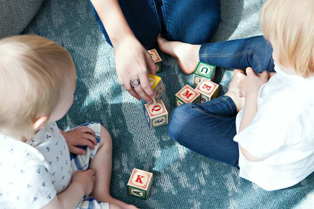 a group of people playing with a toy