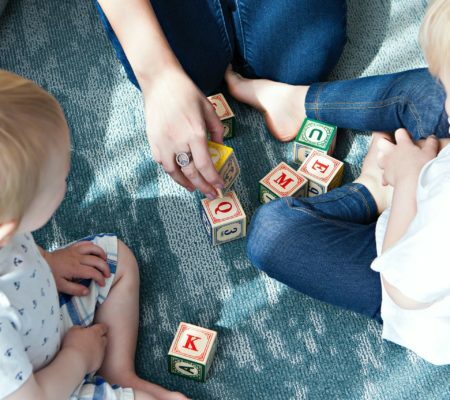 a group of people playing with a toy