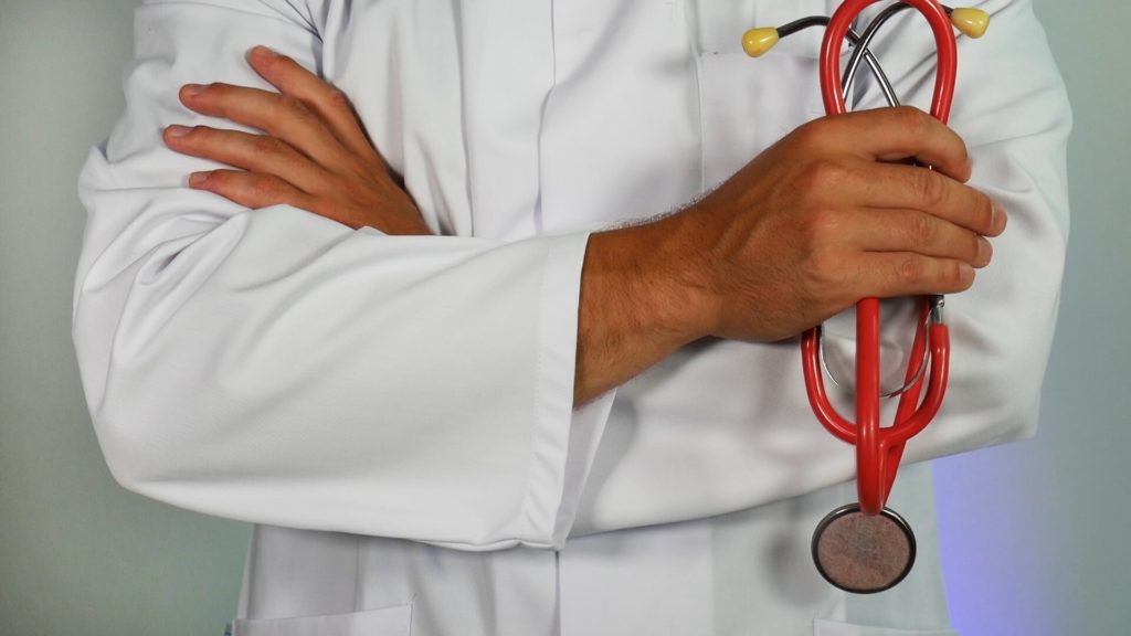 a doctor examining a patient's stomach