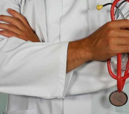 a doctor examining a patient's stomach