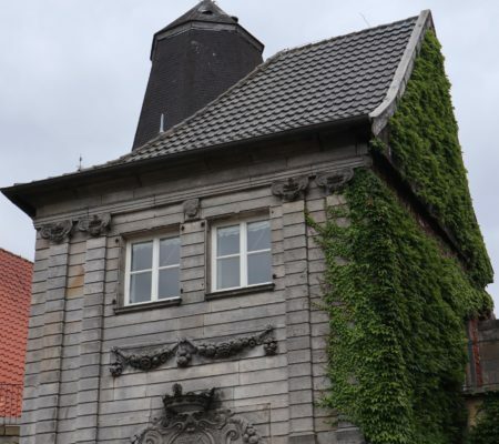 a building with a tree in front