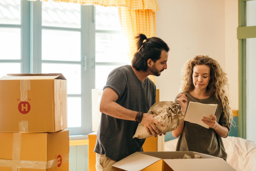 a man and a woman looking at a piece of paper