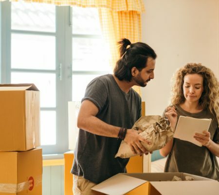 a man and a woman looking at a piece of paper