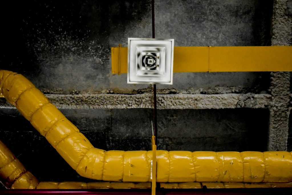 a yellow pipe with a white label