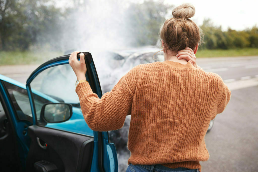 a man looking at a car