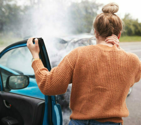 a man looking at a car