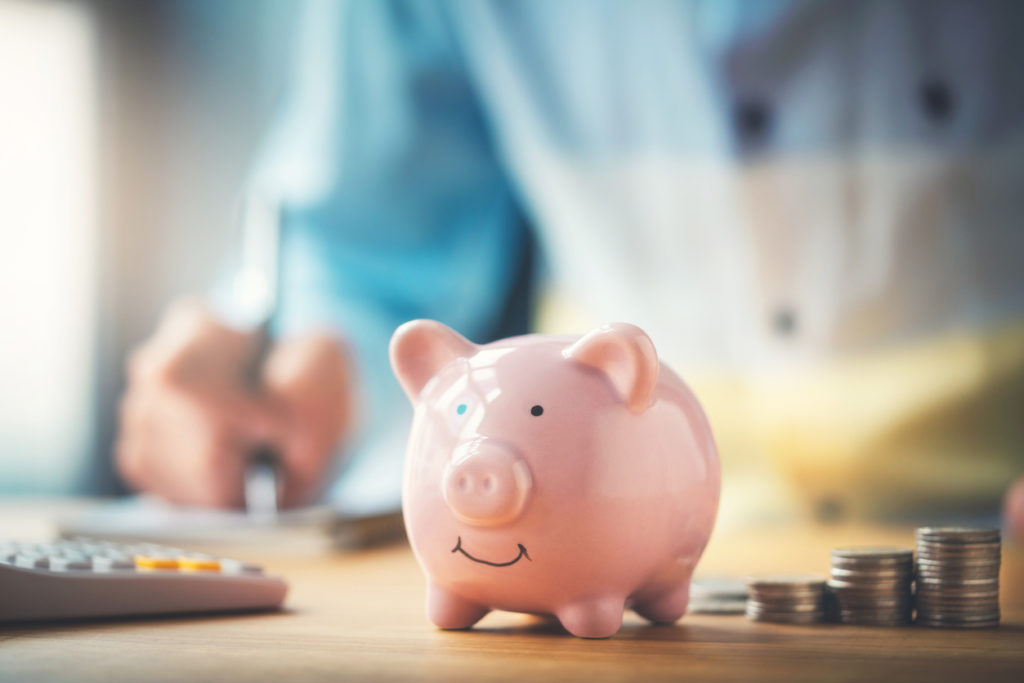 a pink piggy bank on a table