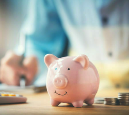 a pink piggy bank on a table