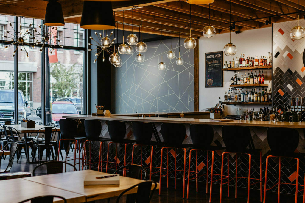 a bar with tables and chairs