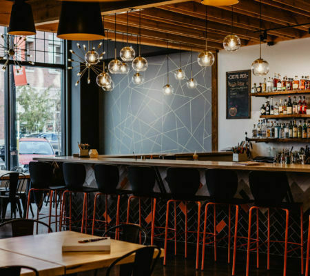 a bar with tables and chairs