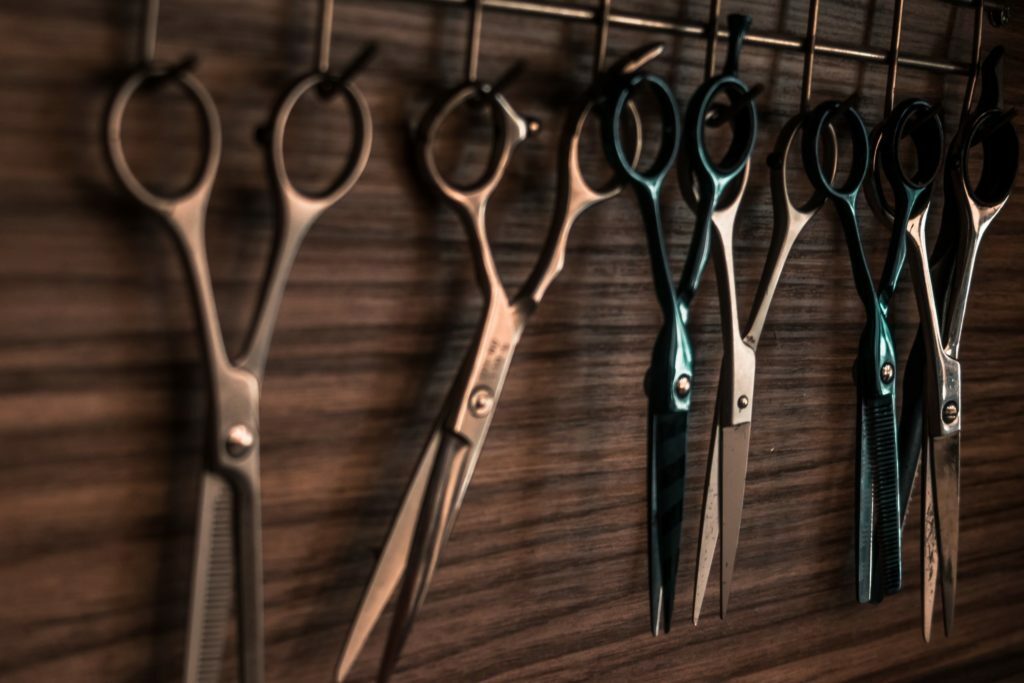 a group of scissors are laid out on a table