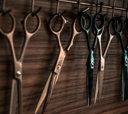 a group of scissors are laid out on a table