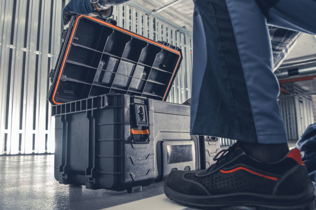 a person stands next to a luggage