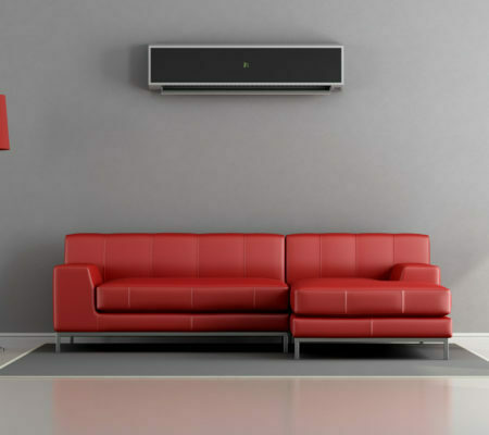 a red couch with a rectangular control