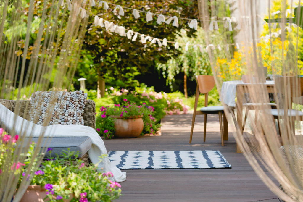 a patio with chairs and tables