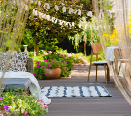 a patio with chairs and tables