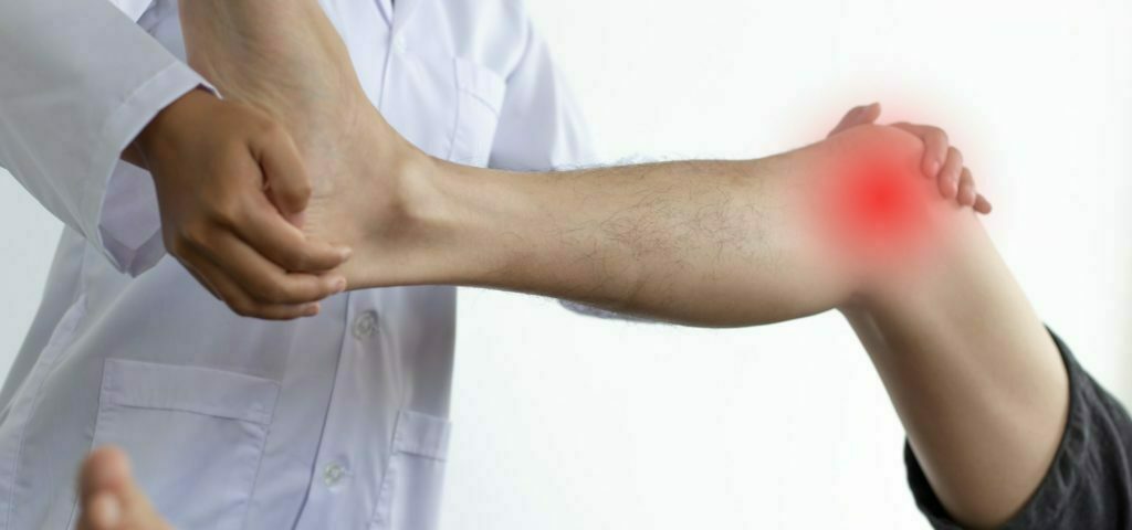 a man's arm with a white shirt and a white background