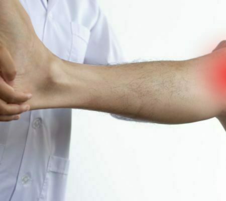 a man's arm with a white shirt and a white background