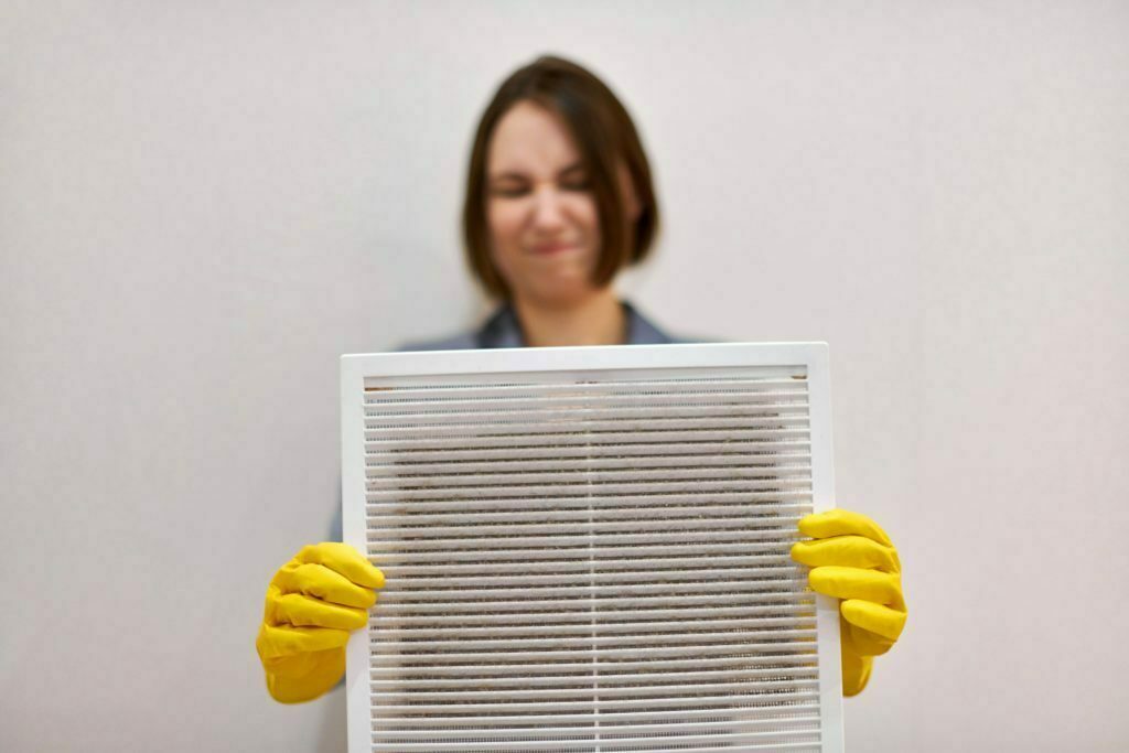 a woman holding a yellow toy