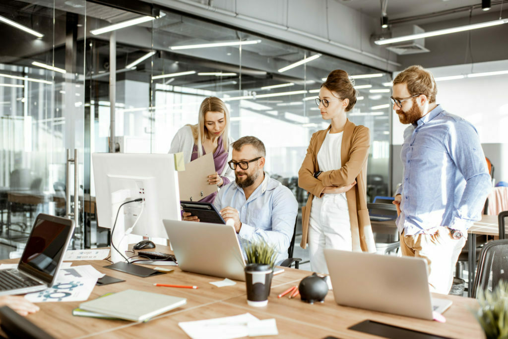 a group of people in an office