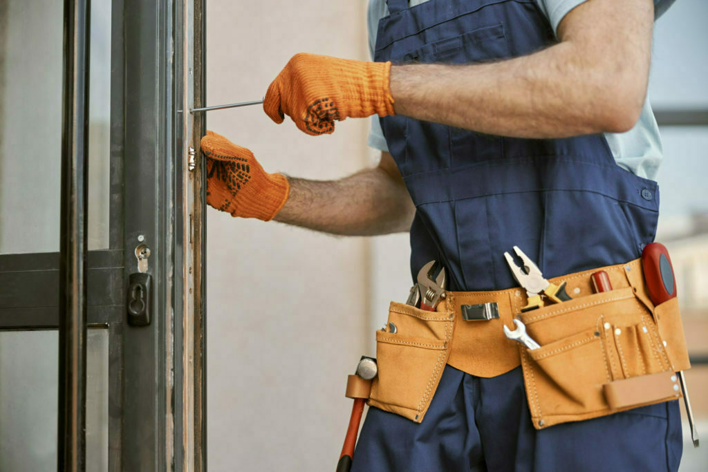 handyman repairing door