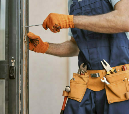 handyman repairing door