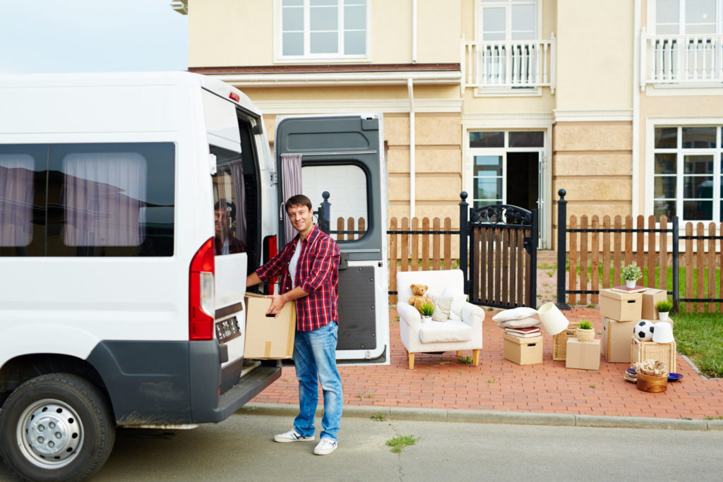 a person standing next to a truck