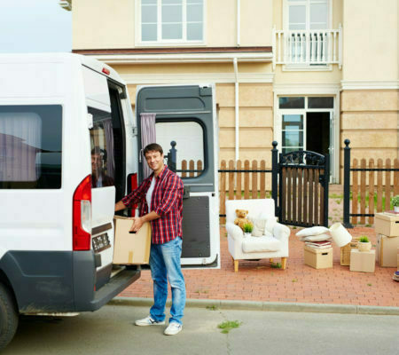 a person standing next to a truck